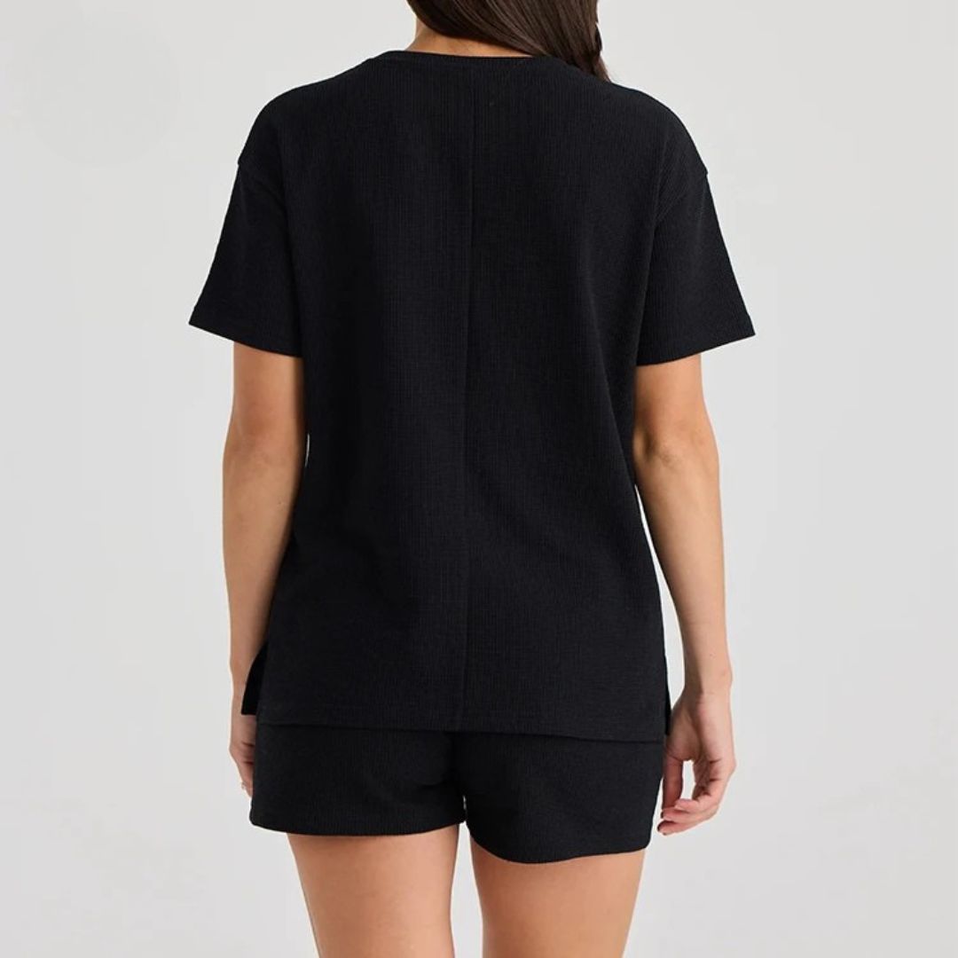Black nursing tee laid flat, an everyday breastfeeding top for mums – Relievoo