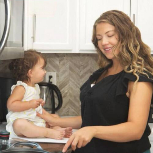 Canadian mom expressing milk at home before returning to work