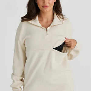 Ivory nursing half-zip worn by a breastfeeding mum, cosy nursing top with zip feeding access – Relievoo