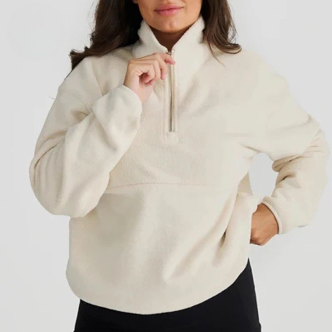 Close-up of the ivory nursing half-zip opening for quick breastfeeding access – Relievoo