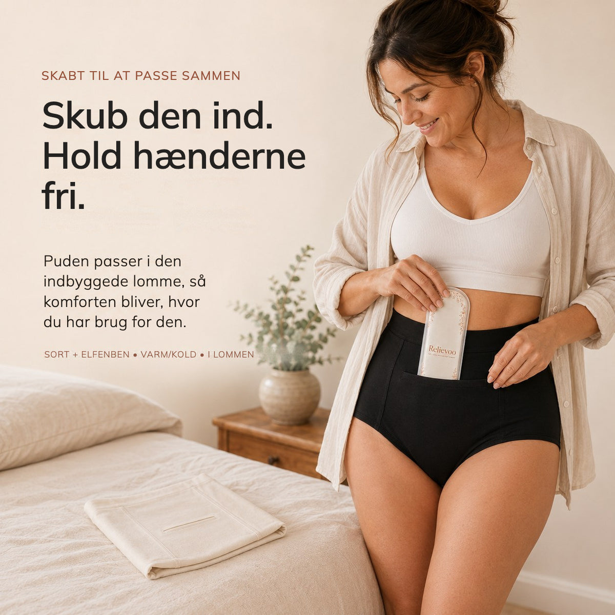 Woman sliding the Relievoo therapy pack into the built-in front pocket of the black high-waisted soothing briefs rvpumpen rvhasar