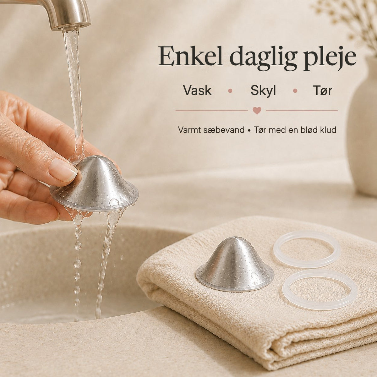 Hands washing a silver nursing cup under warm running water above a cream bathroom basin rvpumpen rvhasar