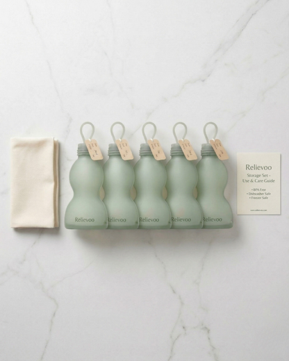 Relievoo reusable silicone breast milk storage bags 5-pack with kraft labels and cotton pouch flat-lay