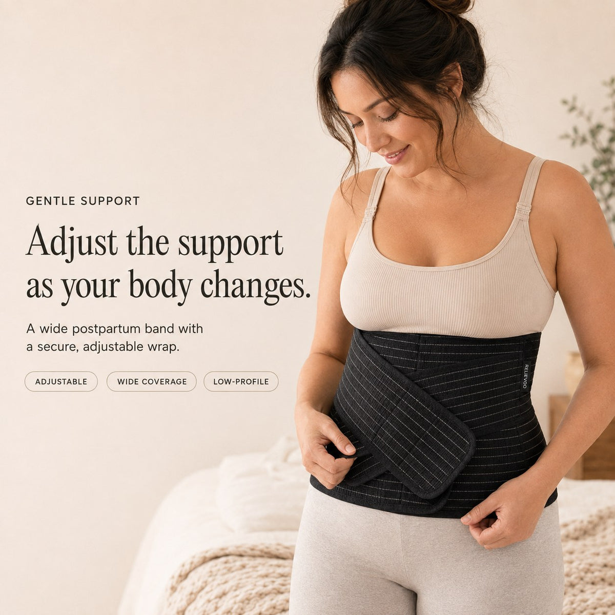 Woman adjusting the black Relievoo postpartum belly band from the complete recovery bundle rvpumpen rvhasar