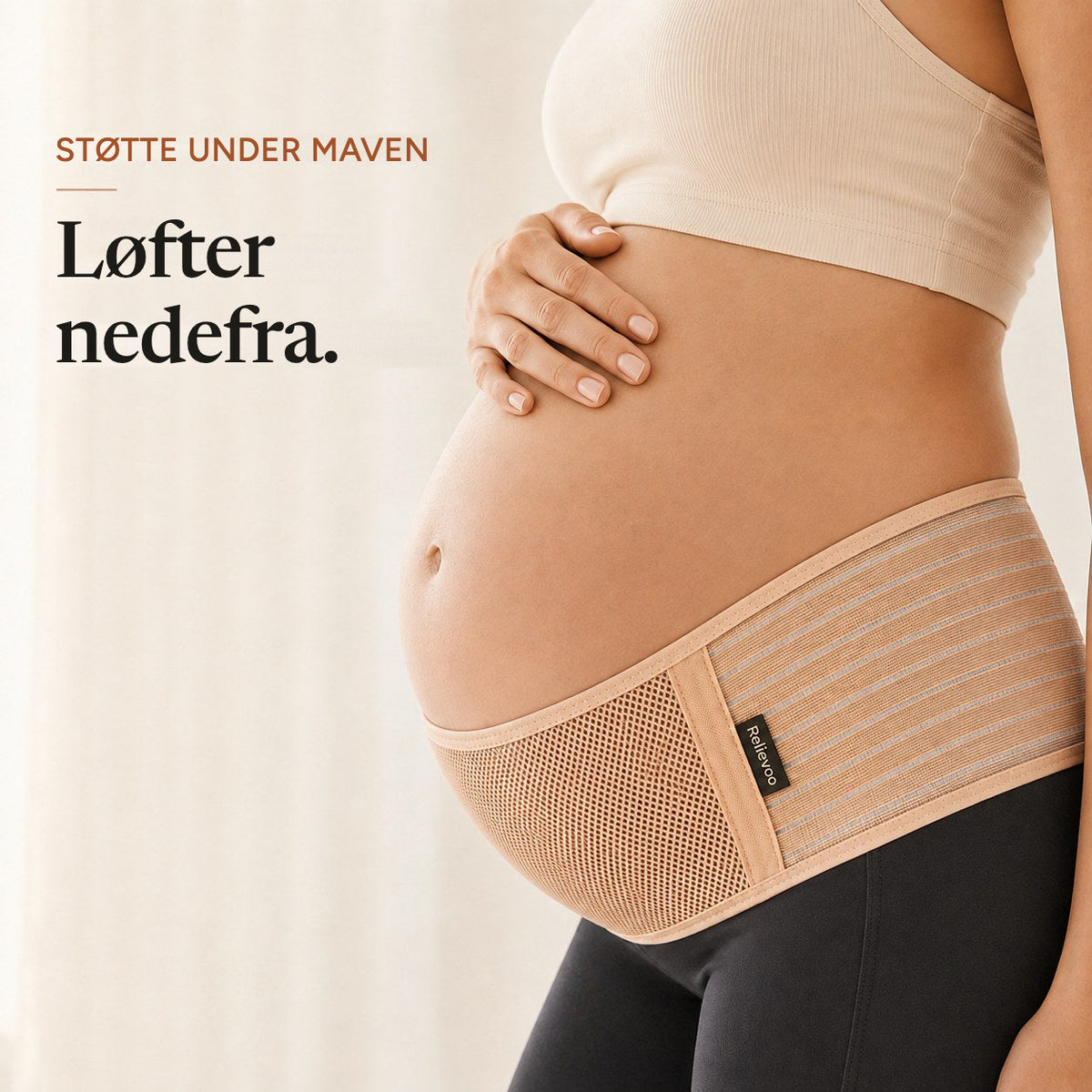 Close-up of the tan Relievoo pregnancy support belt lifting the bump from underneath rvpumpen rvhasar