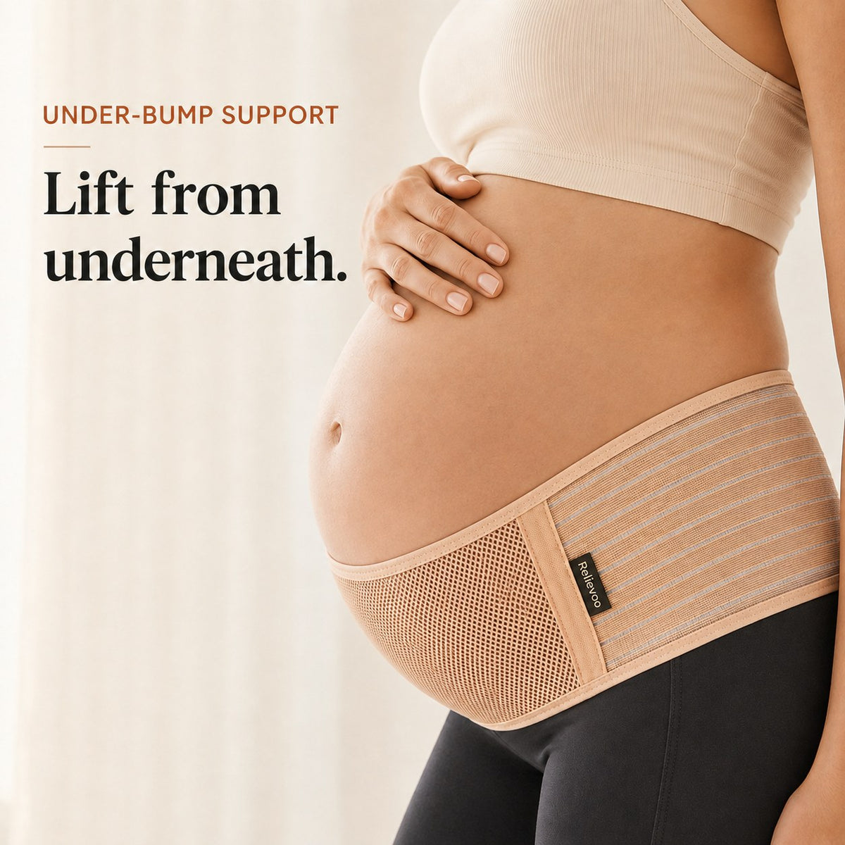 Close-up of the tan Relievoo pregnancy support belt lifting the bump from underneath rvpumpen rvhasar
