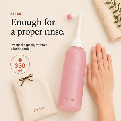 Relievoo peri bottle beside its folded travel pouch with a hand for scale, 350 ml rvpumpen rvhasar