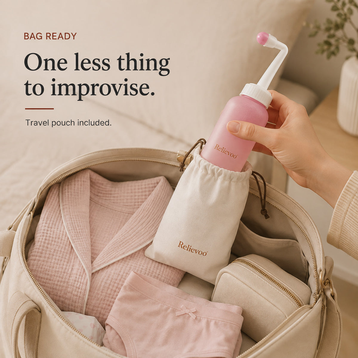 Hand slipping the Relievoo peri bottle into its travel pouch inside a packed hospital bag rvpumpen rvhasar